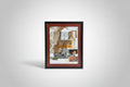 Framed collage leaning against a brick wall